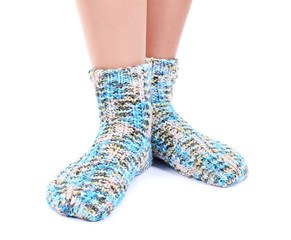 Female legs in colorful socks, isolated on white