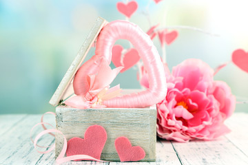 Romantic still life with heart in wooden casket