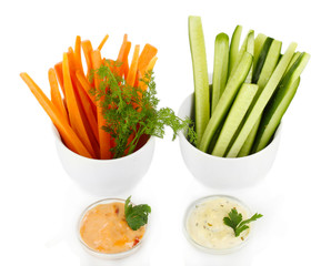 Assorted raw vegetables sticks isolated on white