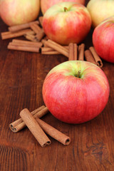 Ripe apples with with cinnamon sticks