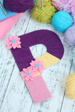 One letter of knit handmade alphabet close up