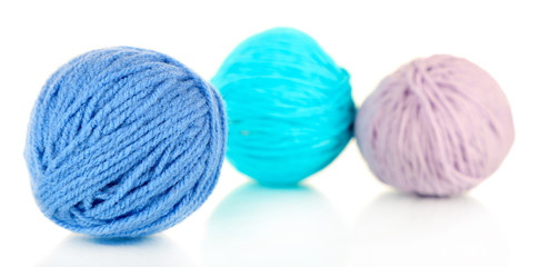 Balls of wool on wooden table background