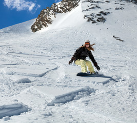 Snowboarder moving down