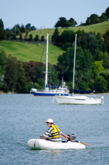 Man sails an inflatable boat