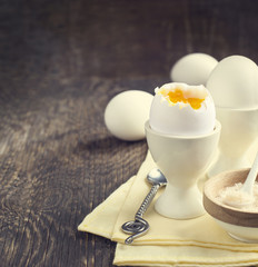 Boiled egg with pink salt for breakfast. Toned image