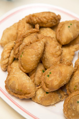 Curry puff on white plate