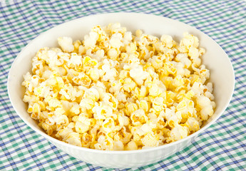 hand picking a caramal popcorn
