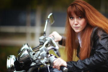 Fototapeta na wymiar girl on a motorcycle