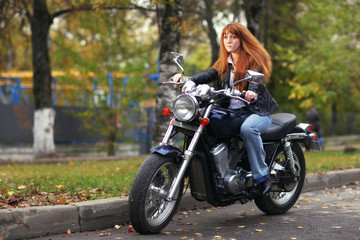 Plakat girl on a motorcycle