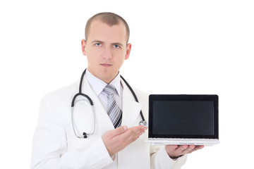 young handsome male doctor showing laptop with copy space isolat