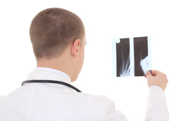 back view of young doctor analyzing x-ray  isolated on white