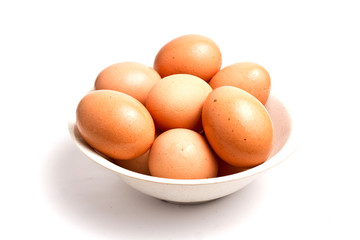 Eggs in a bowl isolated on white