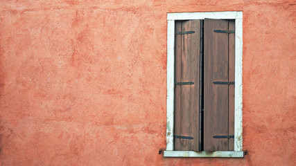 Fototapeta na wymiar window in a red wall