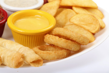 fried onion rings and potatoes