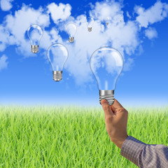 Businessman holding light bulb