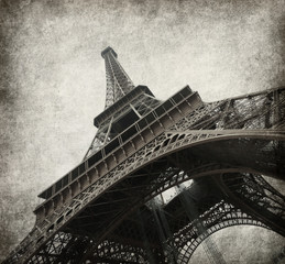 Eiffel tower. Photo in grunge style. Paper texture.