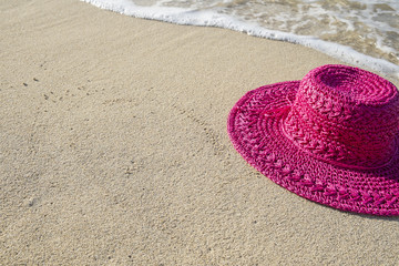 Fototapeta na wymiar Pink Straw Hat on a Caribbean Beach