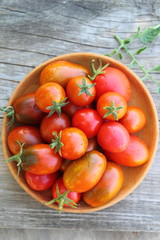 tomatoes in a wooden plate