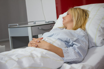 female patient in hospital bed