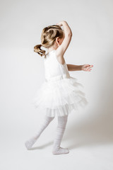 Little Ballerina at Ballet Training on White