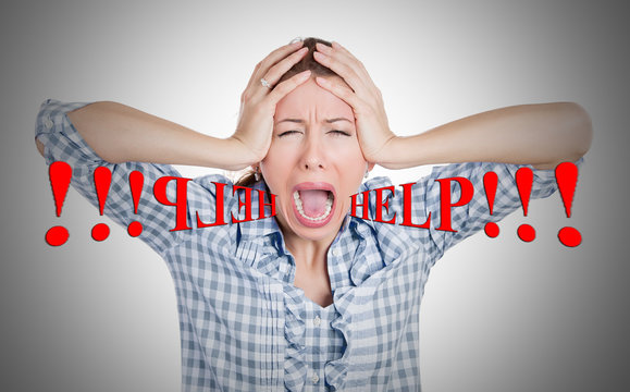 Stressed upset young woman screaming for help