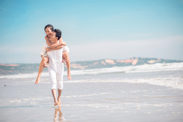 Piggybacking on the beach