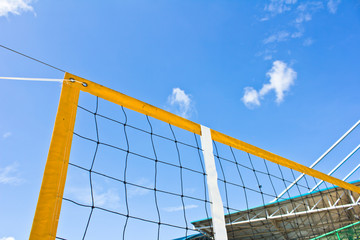 Beach volleyball net with a blue sky