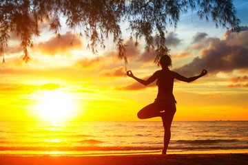Fototapeta premium Young yoga woman silhouette