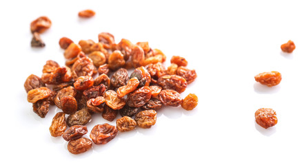 Raisins on white background