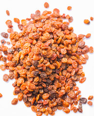 Raisins on white background