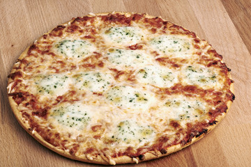 Delicious italian pizza served on wooden table