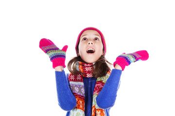 Beautiful little girl in cap and scarf