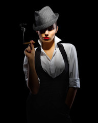 Young woman in manly style with cigar