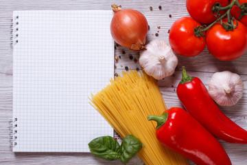spaghetti and ingredients for preparing pasta on the table