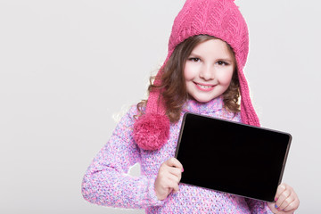 Cute little girl with laptop tablet pc computer