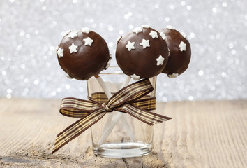 Chocolate cake pops decorated with sugar stars
