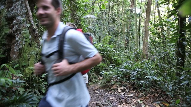 Couple on a trekking day in tropical forest