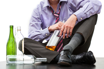Fototapeta premium Depressed businessman drinking alcohol