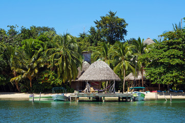 Beachfront eco resort with thatched hut