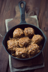 Cast-iron pan with meatballs, high angle view