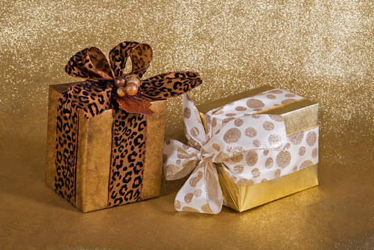 Festive gift wrapped presents on golden background