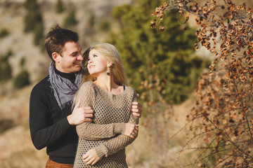 Fototapeta premium portrait of a young couple on a background of mountains