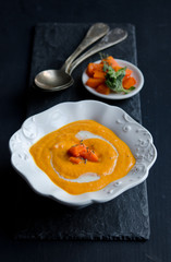 Pumpkin soup on the black background