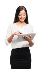 Fototapeta premium A successful and beautiful businesswoman with a tablet