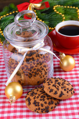 Delicious Christmas cookies in jar on table close-up