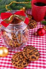 Delicious Christmas cookies in jar on table close-up