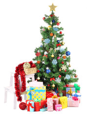 Decorated Christmas tree with gifts isolated on white