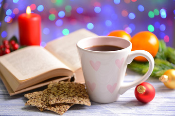 Composition of book with cup of coffee and Christmas