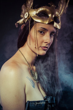 Warrior woman with gold mask, long hair brunette. Long hair. Pro