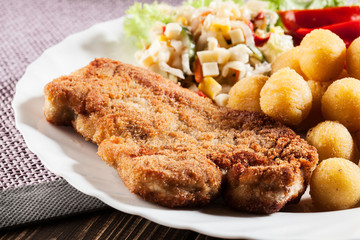 Breaded cutlet and potatoes